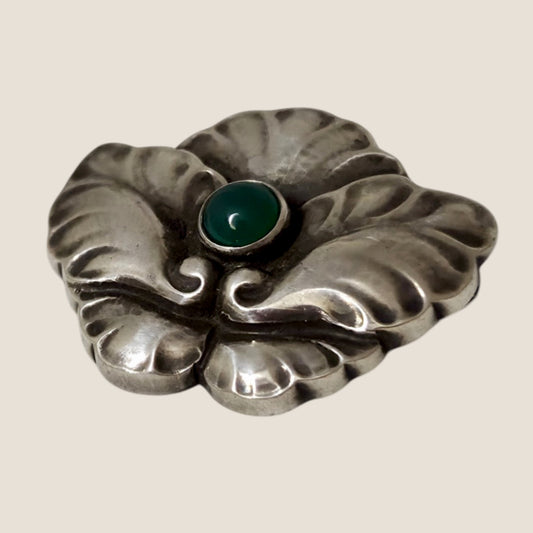 Georg Jensen, Denmark. No. 107. Silver brooch with a green cabochon stone