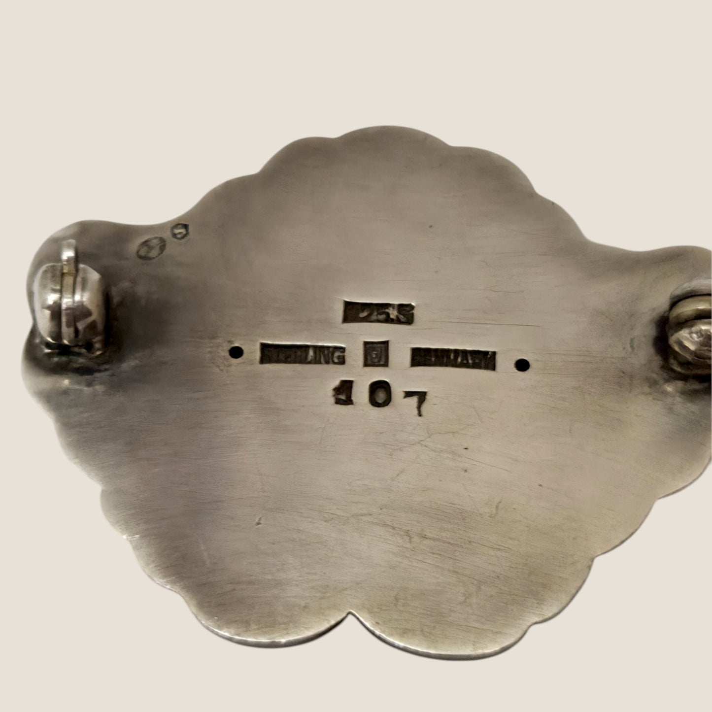 Georg Jensen, Denmark. No. 107. Silver brooch with a green cabochon stone