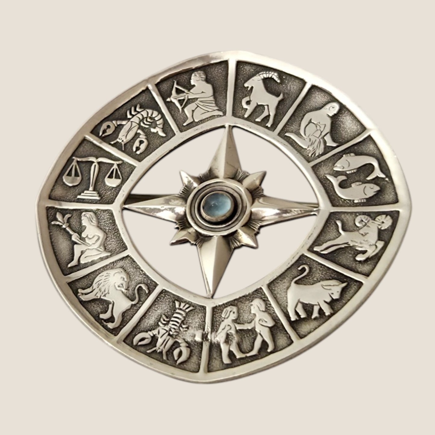 Alton, Sweden, 1962. Silver/ moonstone Zodiac brooch