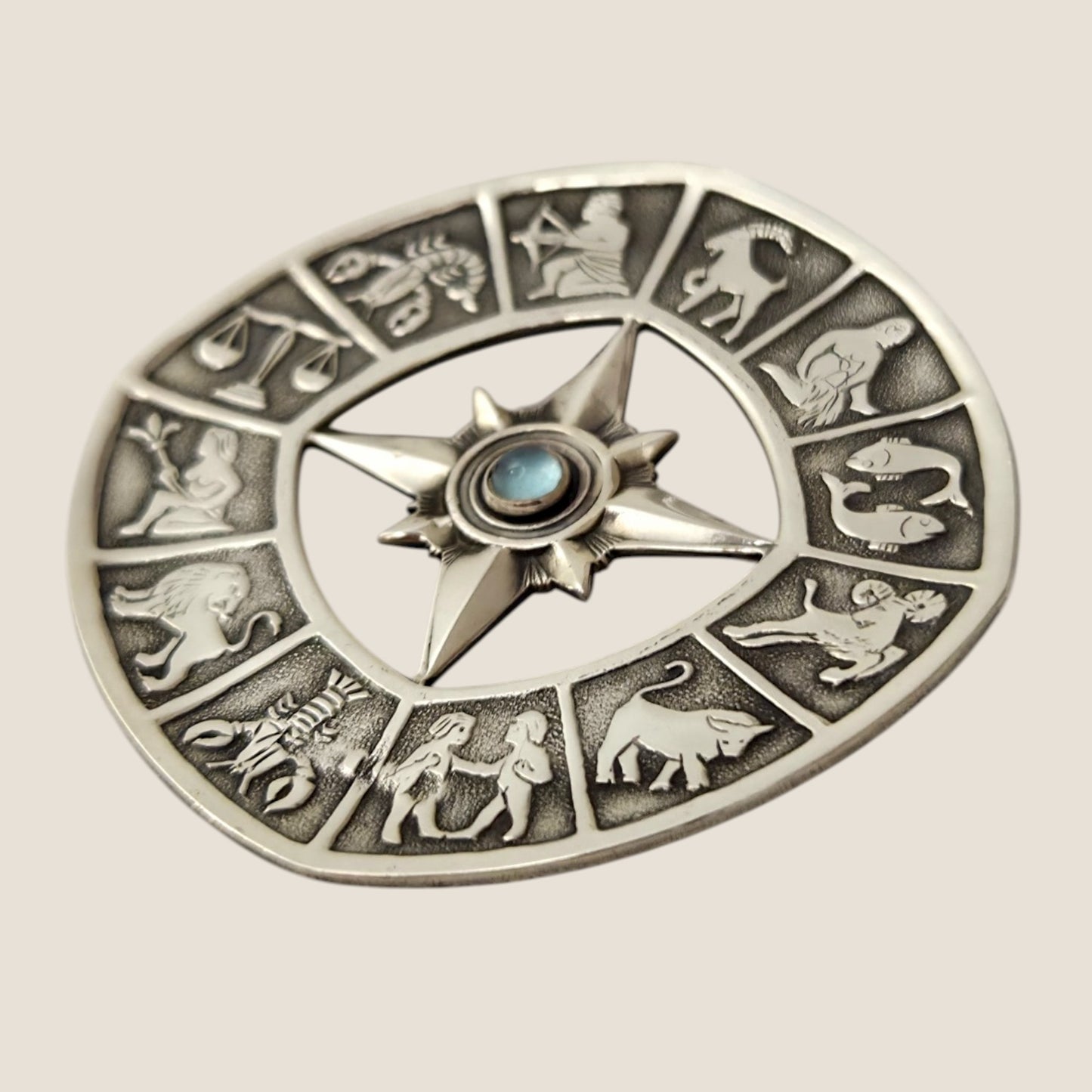 Alton, Sweden, 1962. Silver/ moonstone Zodiac brooch