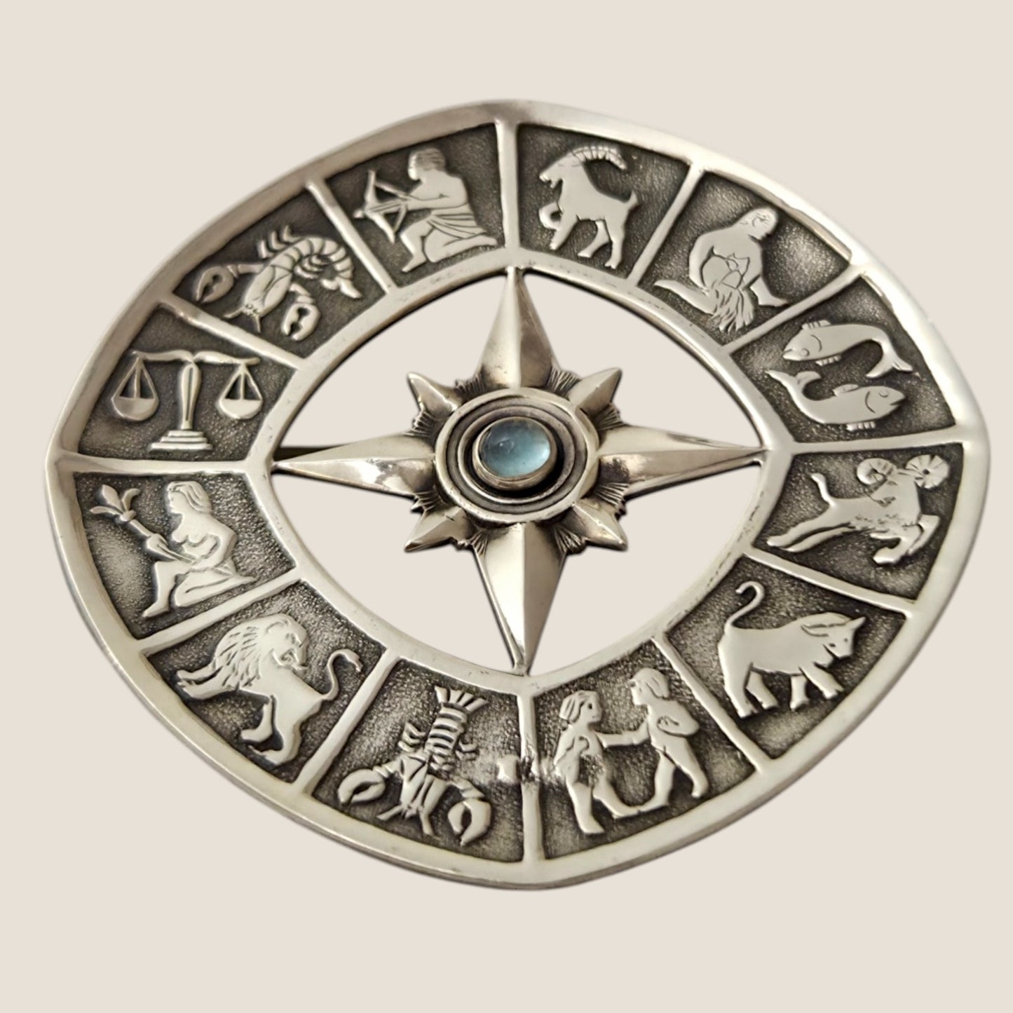 Alton, Sweden, 1962. Silver/ moonstone Zodiac brooch