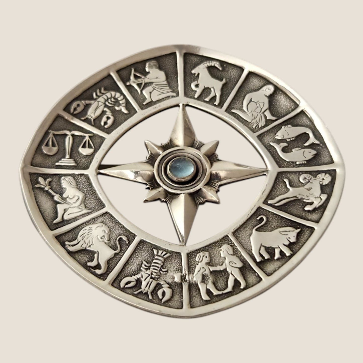 Alton, Sweden, 1962. Silver/ moonstone Zodiac brooch