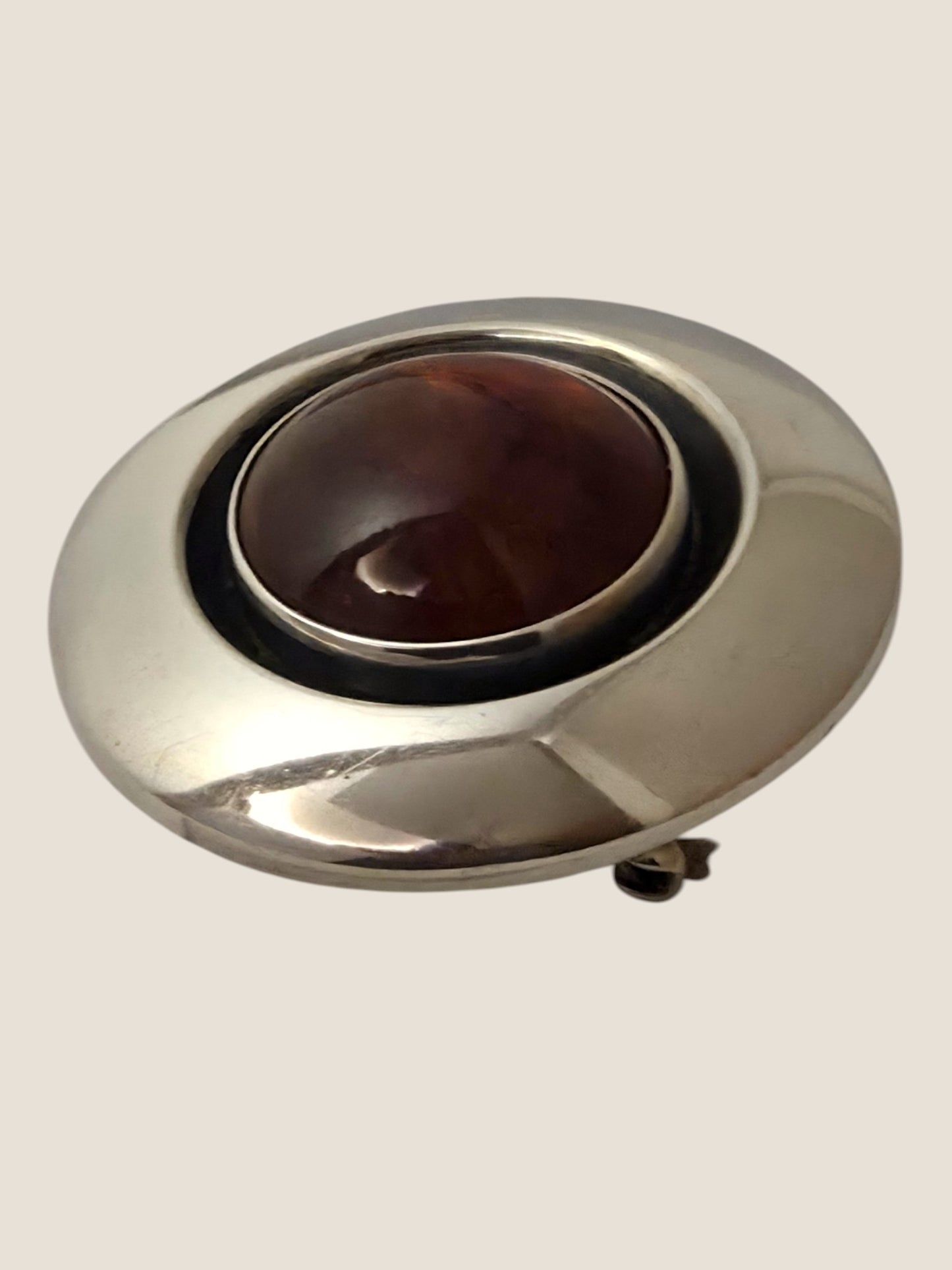 Niels Erik From, Denmark. Sterling silver brooch with amber