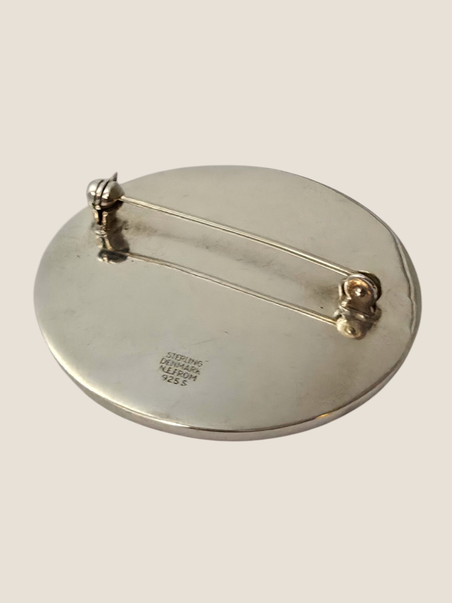 Niels Erik From, Denmark. Sterling silver brooch with amber